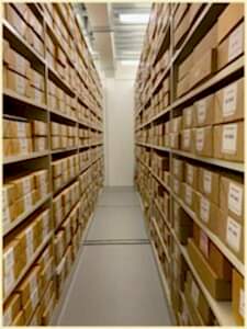 An image showing roller racking on either side housing one of the Special Collections, stored on 108 shelves, in 864 boxes.
