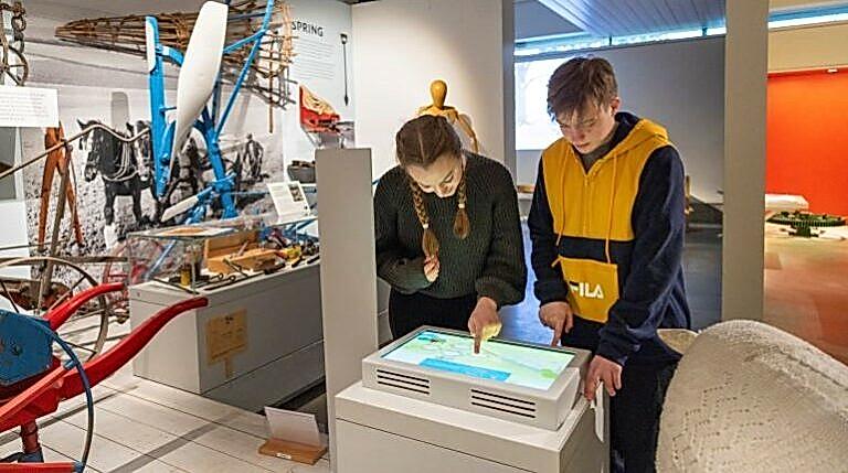 Young people playing an interactive game in the MERL galleries