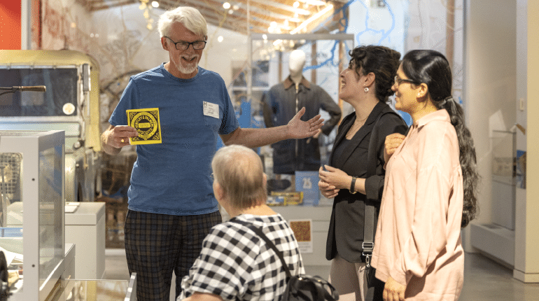 A speaker presents to visitors at The MERL.