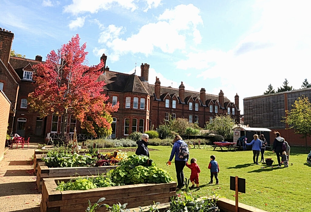 A family explore a beautiful garden.