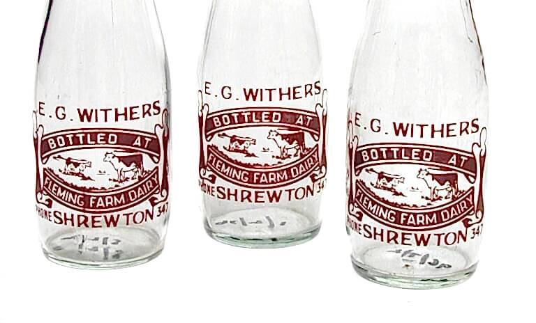 three glass pint milk bottles