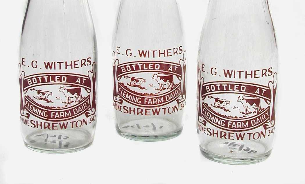 three glass pint milk bottles